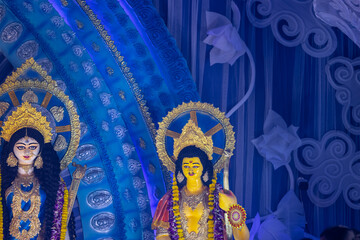 Fototapeta premium Subho mahalaya, An handmade colorful idol of hindu god kartikeya decorated in Pandal during navratri festival.