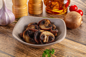 Fried champignon slices in the plate