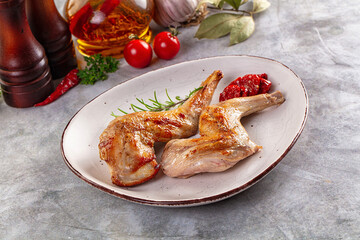 Roasted rabbit leg served rosemary