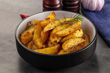 Baked crispy hot potato with rosemary