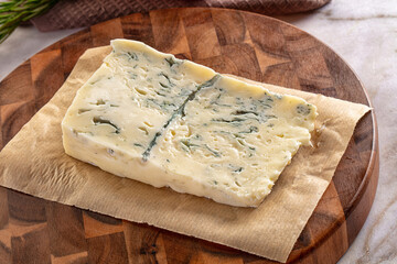 Tasty Italian gorgonzola cheese over board