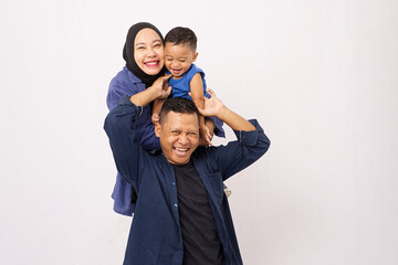 Fototapeta premium the family with blue outfits pose smile together in studio