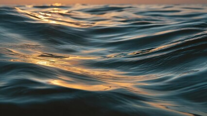 Obraz premium Ocean waves at sunset with golden reflections on the blue water. Concept Sunset Ocean, Golden Reflections, Blue Water, Waves at Dusk, Serene Seascape
