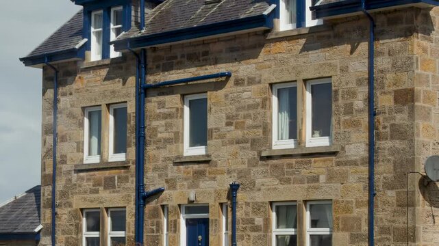Stone House Facade in Cromarty on Cloudy Day
