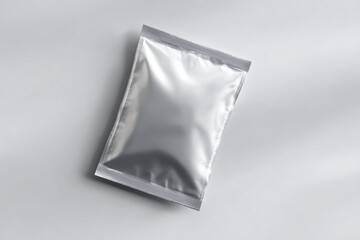 Naklejka premium Silver Foil Snack Packaging Mockup on Clean Background