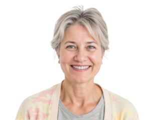 Smiling woman with silver hair wearing a light cardigan and looking cheerful in a bright setting
