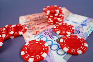 Banknotes of Kazakhstani tenge and gambling addiction. Gambling debts.