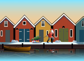A Santa Claus walks on the quay in front of traditional fishing sheds in a Swedish fishing village.
