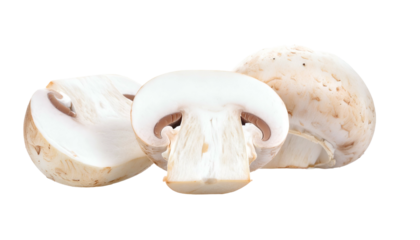 Three button mushrooms on black, one sliced open showing the interior