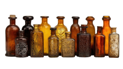 Assorted antique glass bottles of various shapes and amber tones