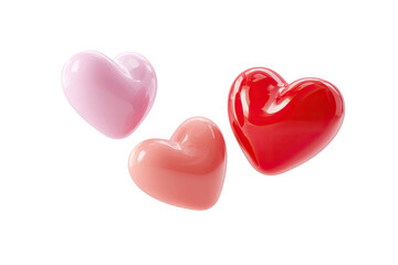 Three glossy heart shapes in red and pink shades float on black