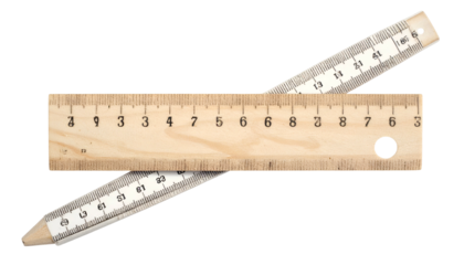 Close-up of two wooden rulers crossing each other on a dark background