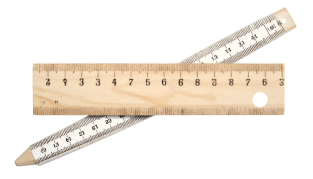 Close-up of two wooden rulers crossing each other on a dark background