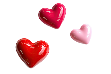 Three glossy, heart-shaped objects in vibrant red and pink hues