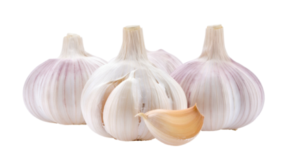 Four garlic bulbs, one clove visible, against a dark backdrop, showing textures and natural light