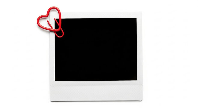 Blank instant photo frame with red heart shaped paper clip, ready for cherished memories and romantic moments