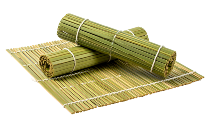 Close-up of rolled bamboo mats and a flat one, all tied with string, isolated on black