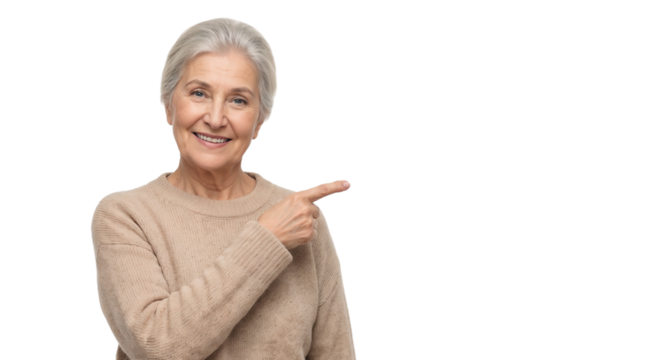 Smiling elderly woman points to the right in a casual setting with a warm expression
