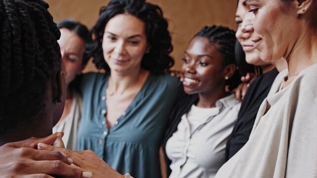 People hug with deep emotion and smile. Friendship brings joy to happy people. Love expressed through strong hug. Emotion shines between people. Smile and hug reflect emotion and friendship.