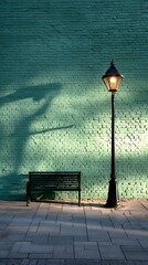 Street Lamp and Bench Against Green Brick Wall at Night