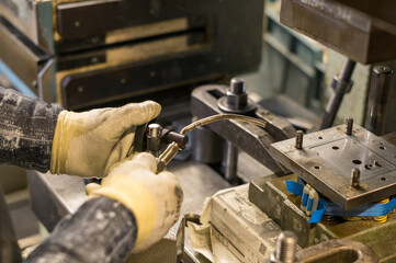Precision Hand Work in a Metal Processing Factory
