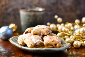 Traditional christmas cookies in a bowl on a rustic wooden background. Soft focus.	