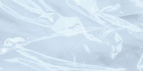 Wrinkled transparent plastic texture with glossy surface and abstract fold pattern