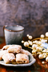 Traditional christmas cookies in a bowl on a rustic wooden background. Soft focus.	