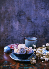 Traditional christmas cookies in a bowl on a rustic wooden background. Soft focus.	