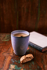 Cup of coffee on rustic wooden background. Soft focus. Copy space	