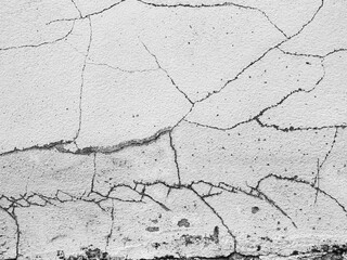 Crack wall texture background broken earthquake effect, whtie grey building cement damage pattern plaster grunge black line paint surface abstract, construction rough street concrete backdrop.