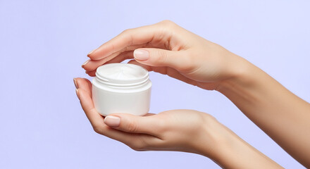 Model Hands Holding an Open White Cream Jar Framed From Mid-Torso to Hands