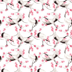 Obraz premium Seamless pattern of japanese cranes with the pink sakura branches on background. Watercolor handmade illustration. For fabric, wallpaper, greeting cards, design, decoration and illustration.