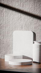 White marble podiums on wood table for product display. Minimalist 3D render with vase and textured wall. Sunlit background for cosmetic or skincare mockup with natural lighting and strong shadows.