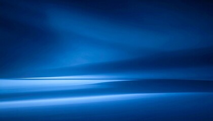 Fototapeta premium Blurred deep blue gradient wallpaper featuring smooth color transitions, a soft glowing center, calming and atmospheric design, perfect for digital backgrounds, desktop screens, creative projects, pre