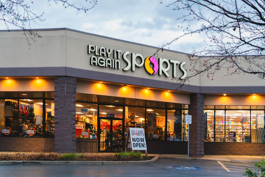 Dewitt, NY - Nov 23, 2025: Night view of Play It Again Sports, a resale retail chain specializing in new and gently used sporting goods. Founded in 1983 as part of Winmark Corporation&rsquo;s family