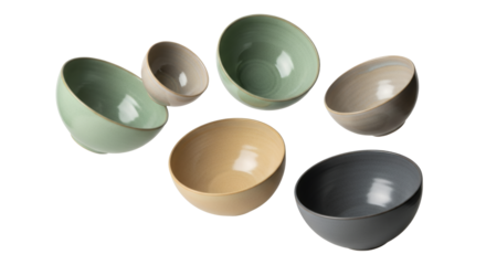 Elegant arrangement of multi-colored ceramic bowls on a clean white surface evokes minimalist charm
