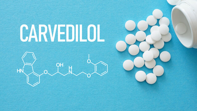 Carvedilol Tablets and Chemical Formula on Blue Background. Beta Blocker White Pills