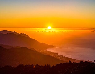 Aerial view of an island coastline at sunrise with golden hues
