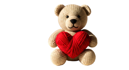 Hand-knitted teddy bear holding a big red yarn heart