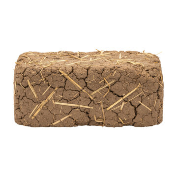 Cracked adobe brick with straw texture isolated on a black background