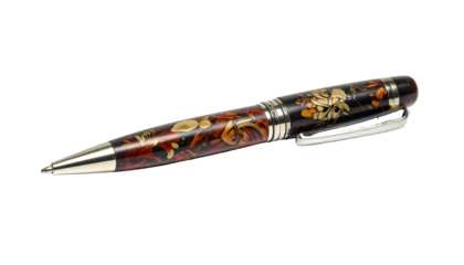 A close-up shot of a decorative ballpoint pen with intricate floral designs