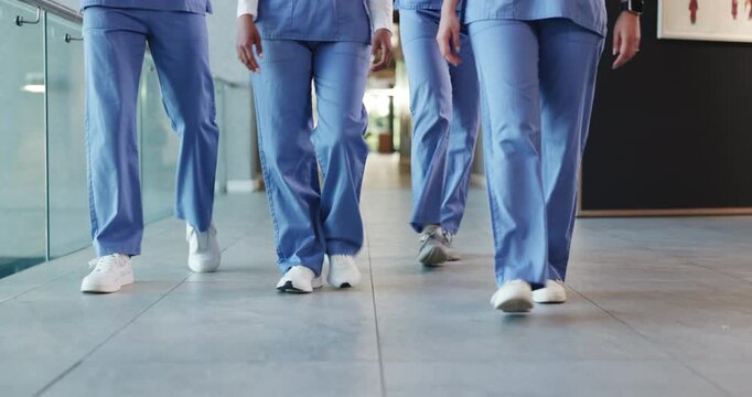 Group, legs of nurses and walking in hospital corridor for medical service, ward round and teamwork. Nursing staff, people and on the move in clinic hallway for healthcare treatment and shift start