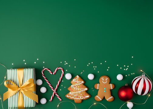 Vibrant green Christmas celebration scene featuring a wrapped gift with gold ribbon, candy canes, gingerbread cookies and ornaments. Evoking festive cheer gifts and holiday greetings card. - Powered by Adobe