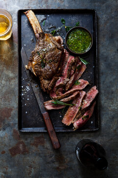Meat beef steak garnished with salt and herbs