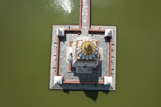 Rani Pokhari, the historic royal pond in Kathmandu, reflects the city skyline and surrounding temples, blending serene waters with Nepal&rsquo;s vibrant urban and cultural heritage.