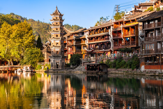Fenghuang ancient town, China with pagoda. Traditional chinese wooden houses in old watertown