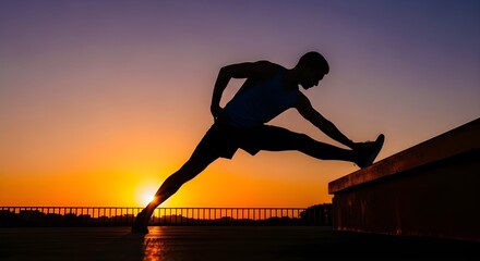 Silhouette of a person stretching at sunset outdoors