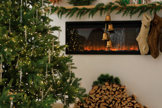Cozy holiday scene with decorated tree fireplace and warm atmosphere during winter season