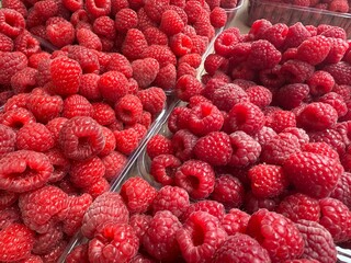 Raspberries on a farm market in the city. Fruits and vegetables at a farmers market.